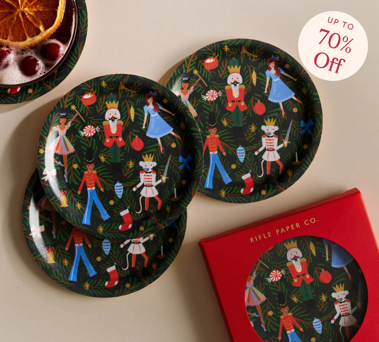 Decorative plates with festive designs on a beige surface, with a '70% Off' label.